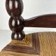 Brutalist wood turned bobbin low rush chair n the style of Charles Dudouyt