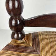 Brutalist wood turned bobbin low rush chair n the style of Charles Dudouyt