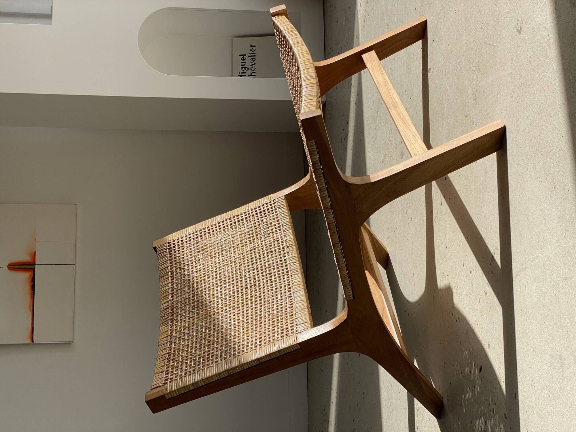 Reclining armchair in natural wood and woven rattan