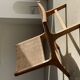 Reclining armchair in natural wood and woven rattan