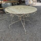 Old garden table in solid wrought iron