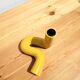 Yellow ceramic twist candle holder