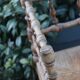 Antique corner chair in wood bamboo style seated in straw