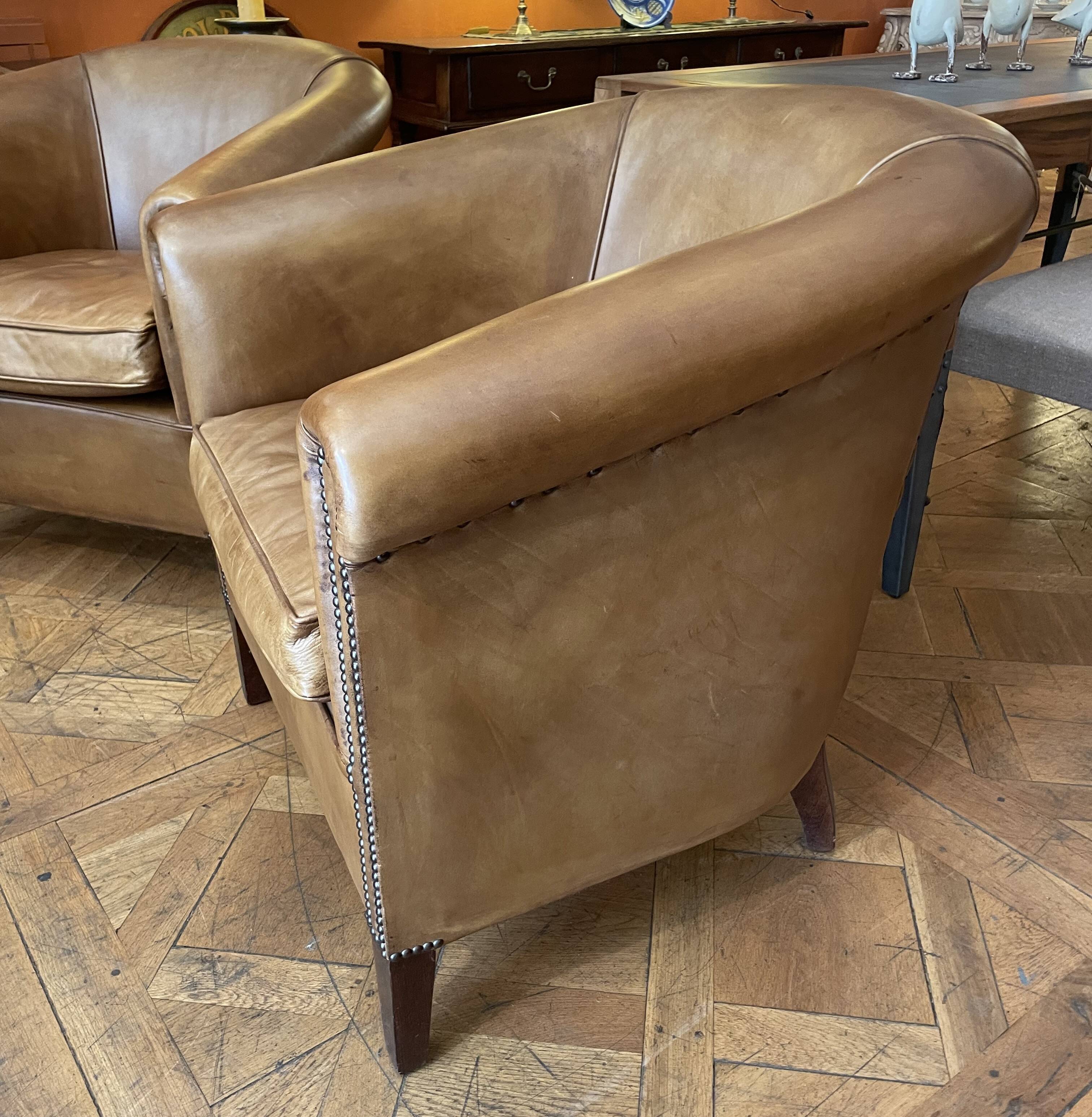 pair of camel leather club armchairs