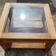Glass coffee table in wood