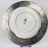 Decorative earthenware and pewter wall plate with spring flowers