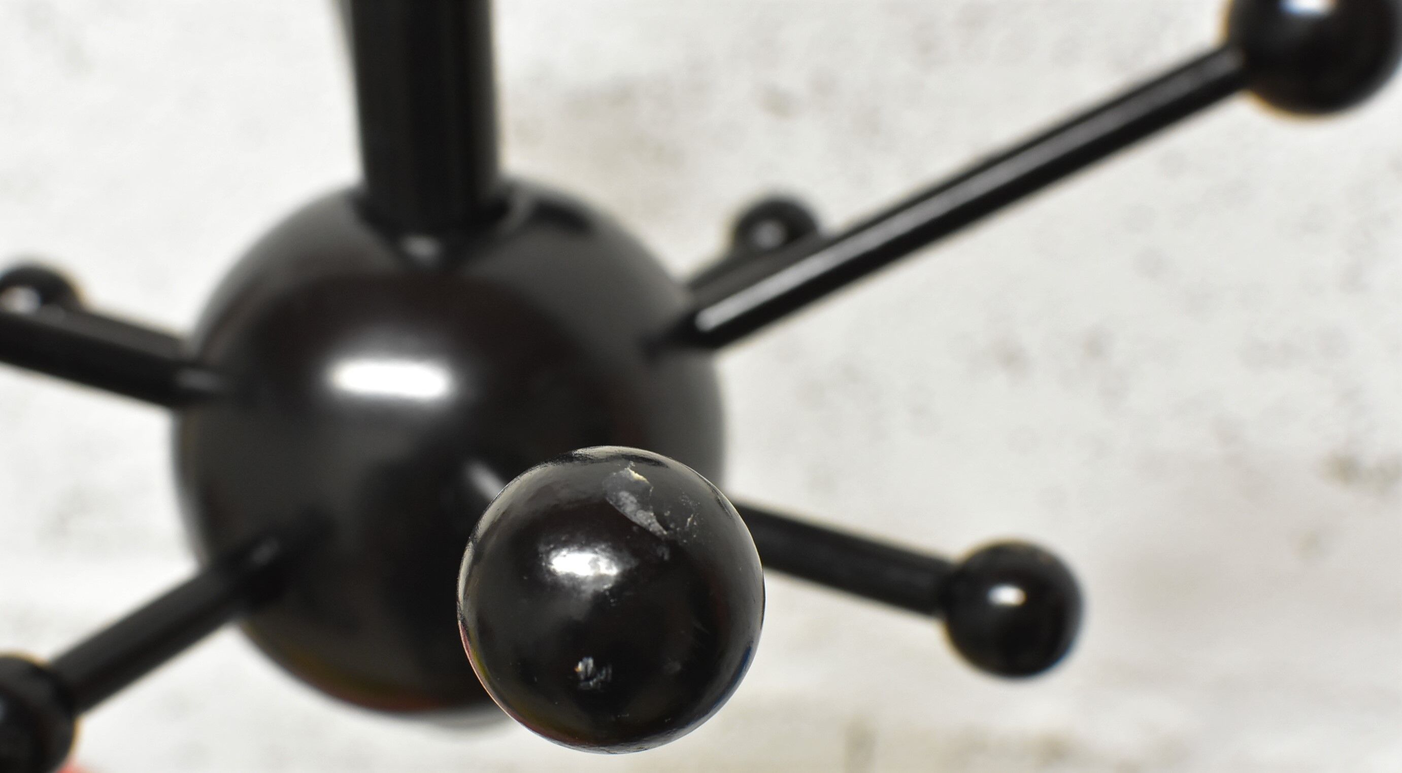 Black sputnik coat rack