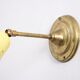Wall lamp inlaiton and pale yellow lacquered metal