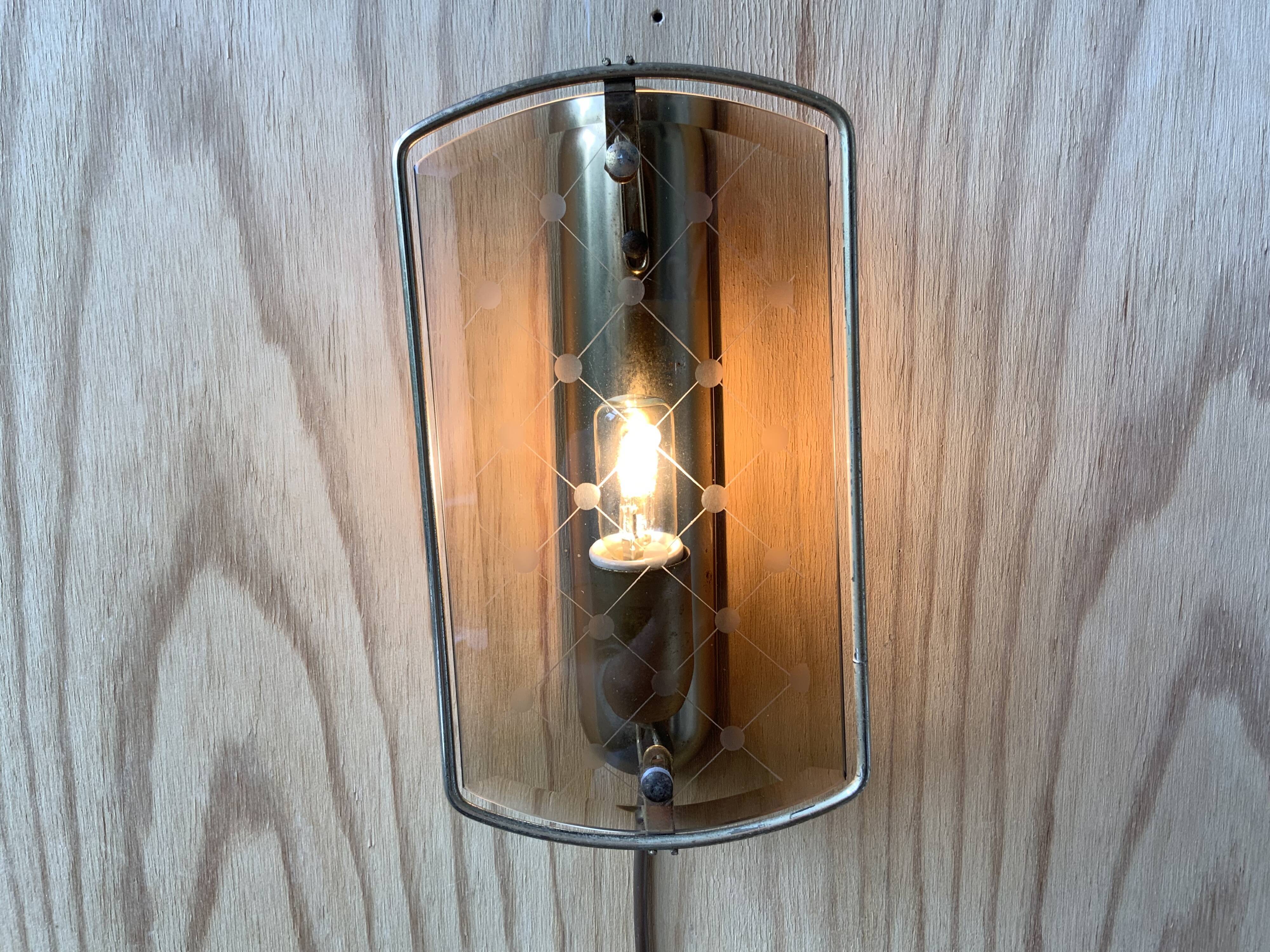 Brass wall lamp and smoked glass
