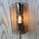 Brass wall lamp and smoked glass