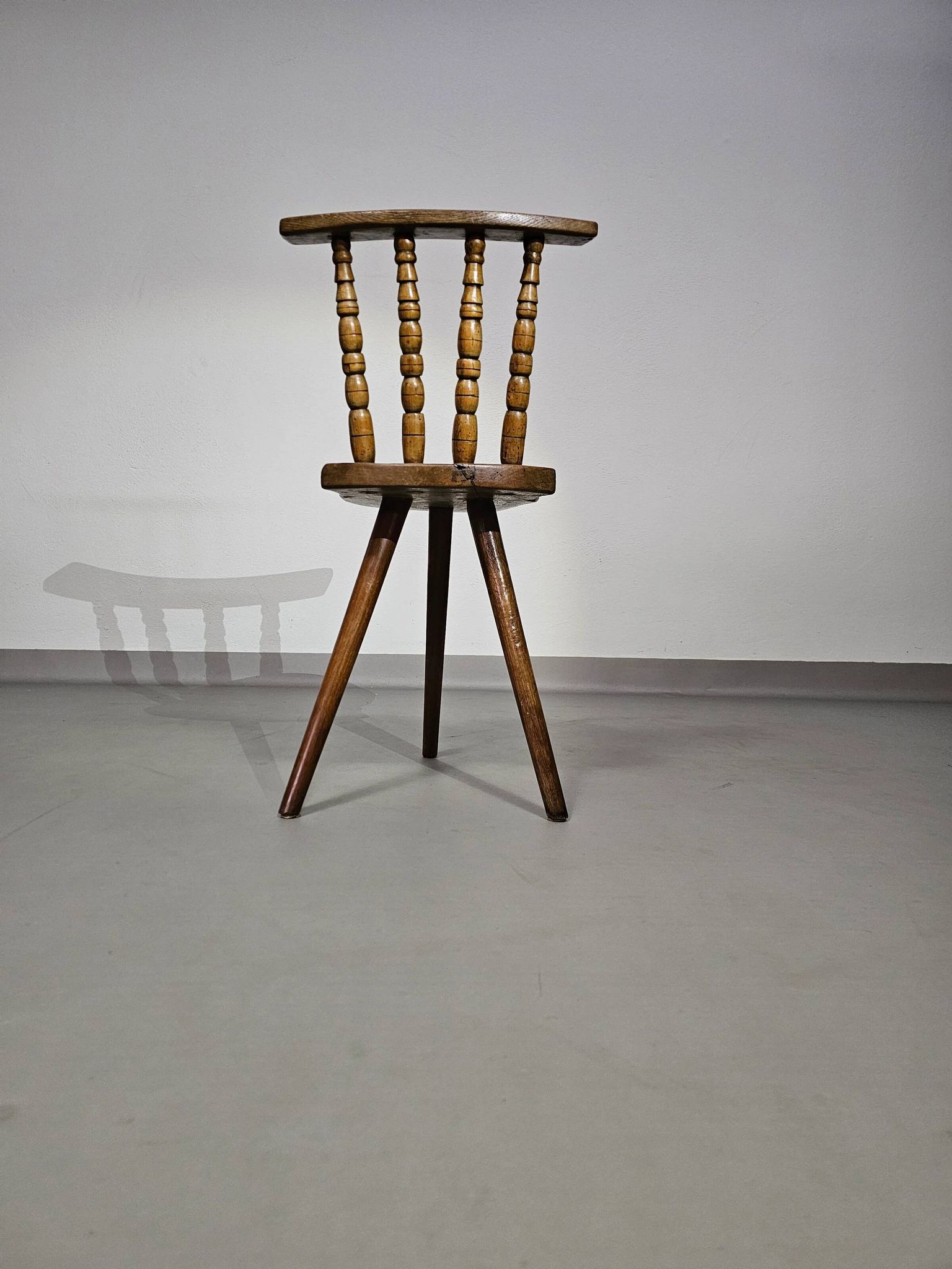 Old farmers tripod chair for decorative use