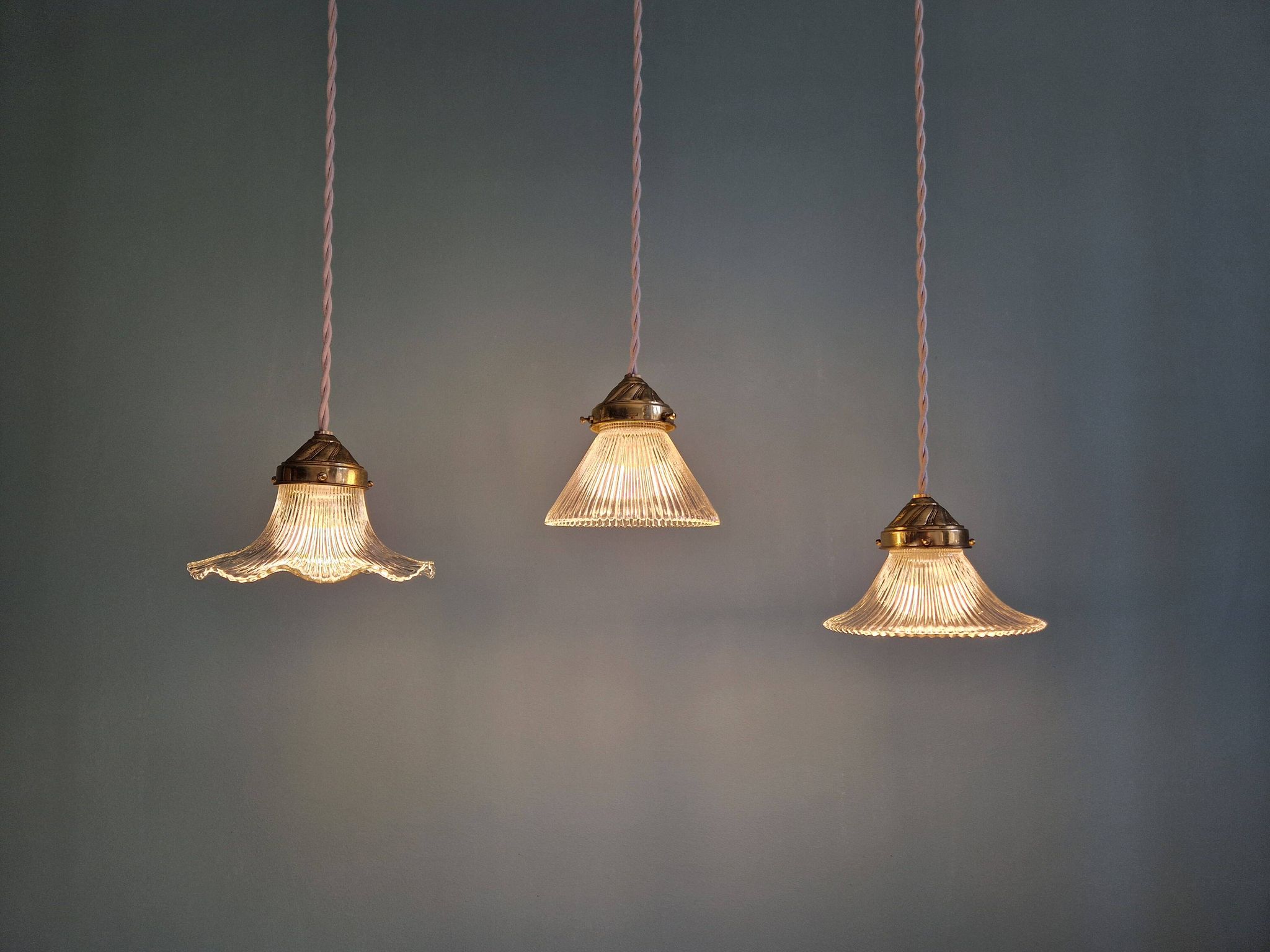 Trio of Art Deco grooved glass pendant lights, 1920s-30s