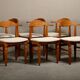 Henning Kjærnulf dining chairs set in Oak and Off White Bouclé, Denmark, 1960s