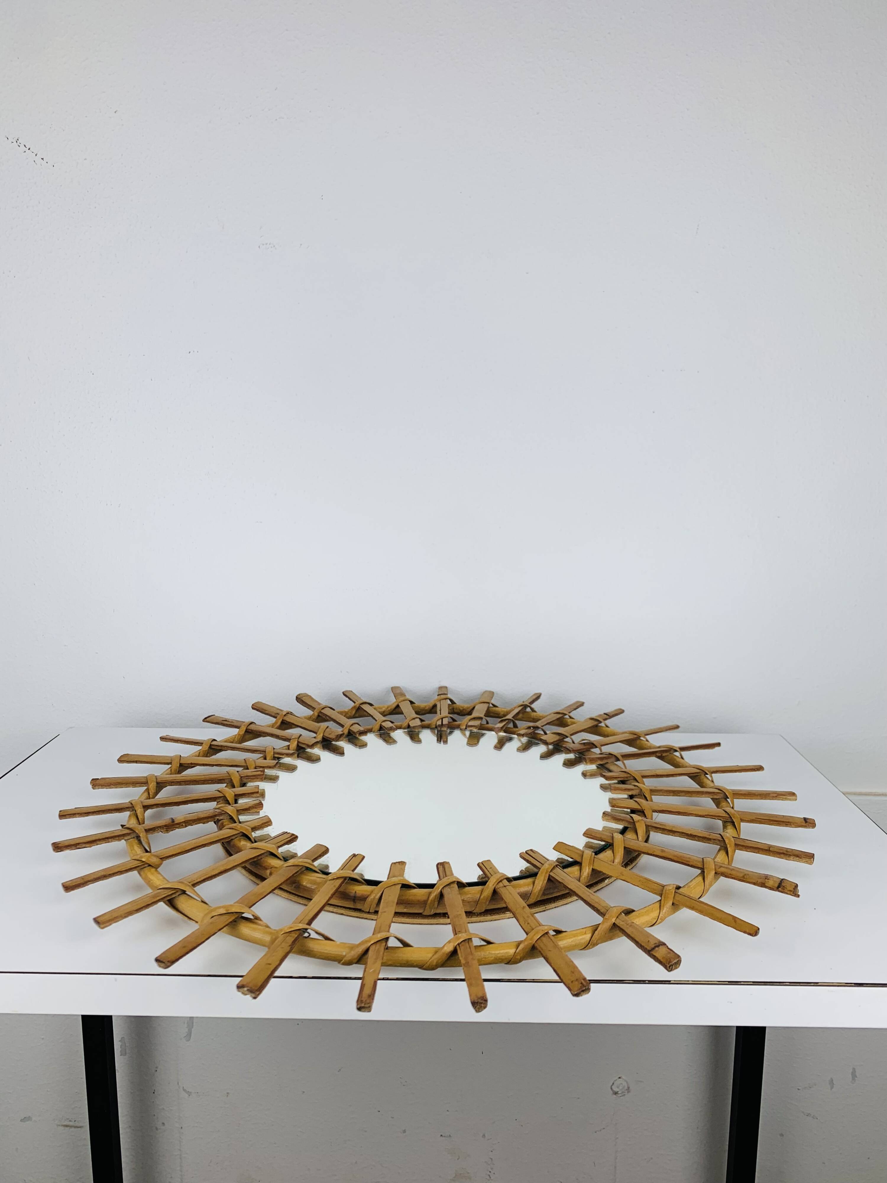 Vintage rattan sunburst mirror from the 1960s