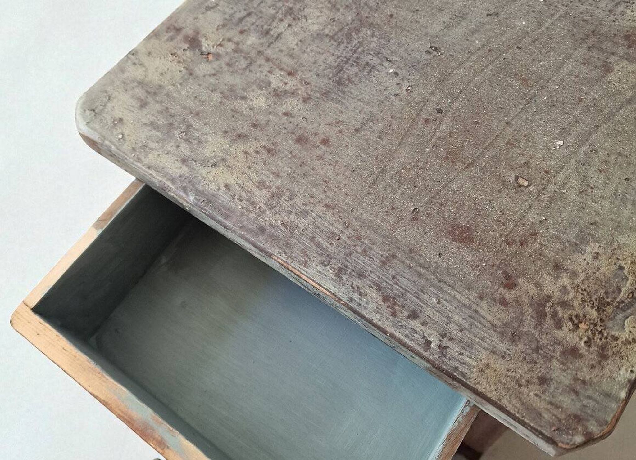Pair of antique bedside tables with a green patina