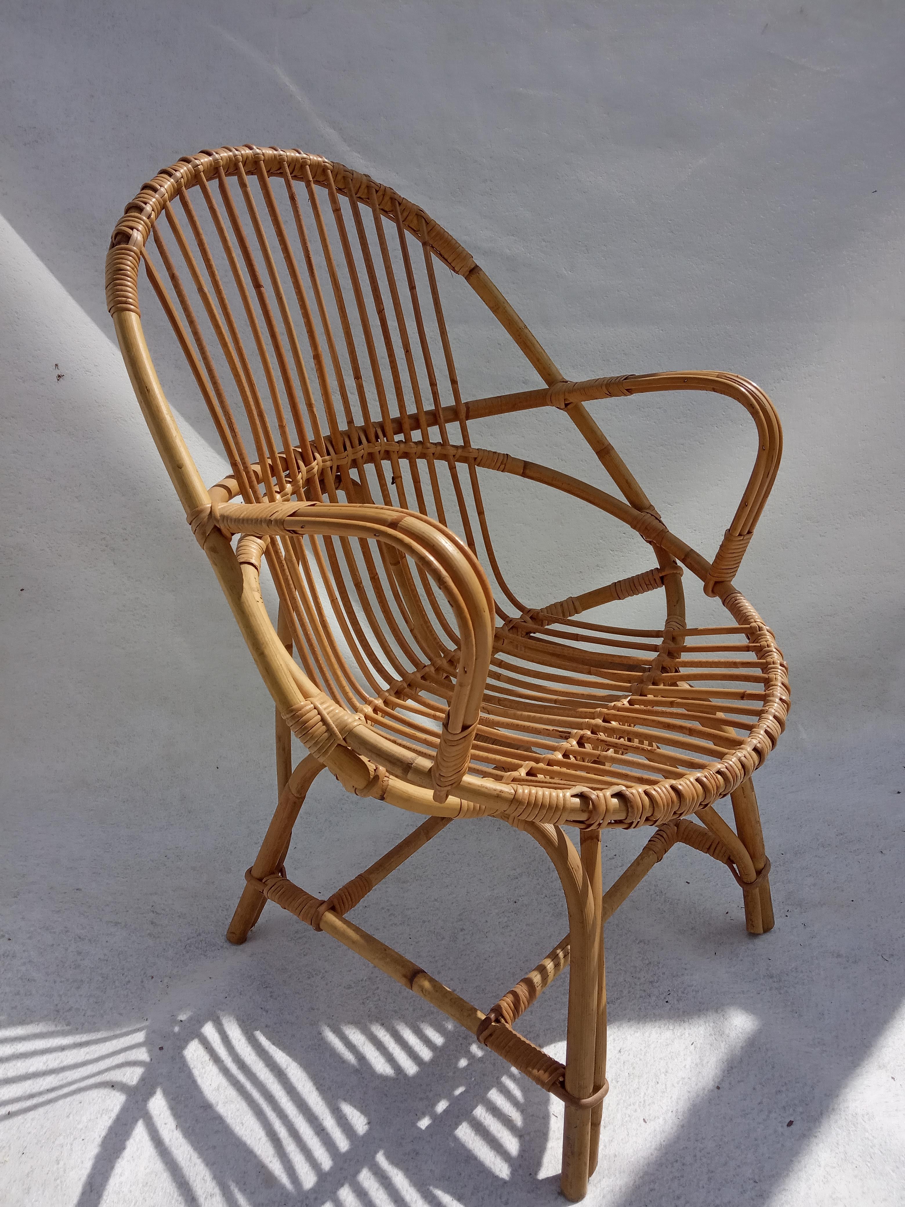 Armchair and footrest in rattan, years 50/60