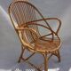 Armchair and footrest in rattan, years 50/60