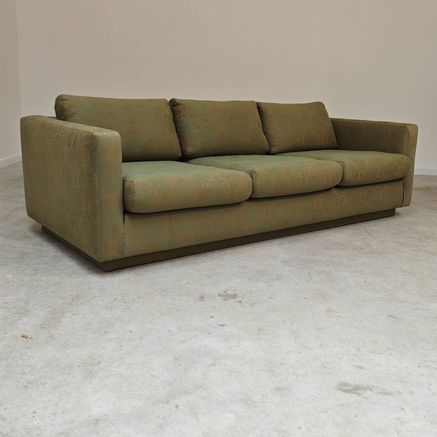 Pierre Frey modernist bench in green and gold patterned fabric