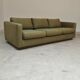Pierre Frey modernist bench in green and gold patterned fabric