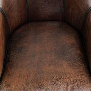 Vintage sheepskin armchair with a unique design and timeless appearance