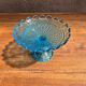Blue glass footed fruit bowl.