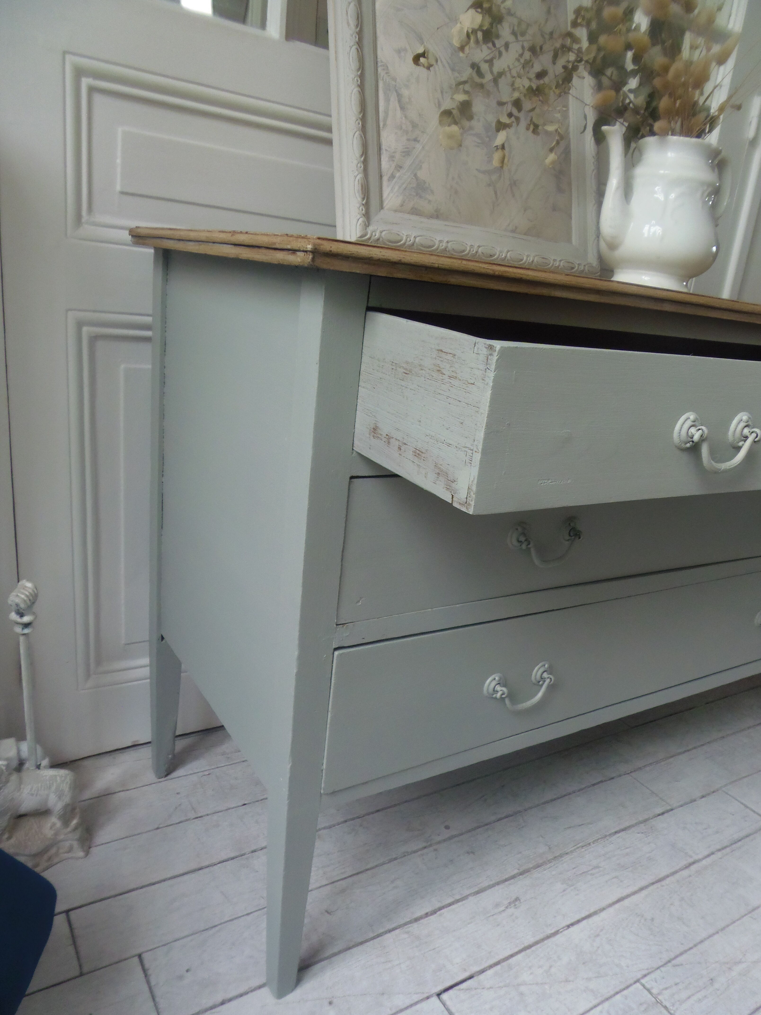 Green green vintage chest of drawers of gray, wood top.