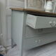 Green green vintage chest of drawers of gray, wood top.