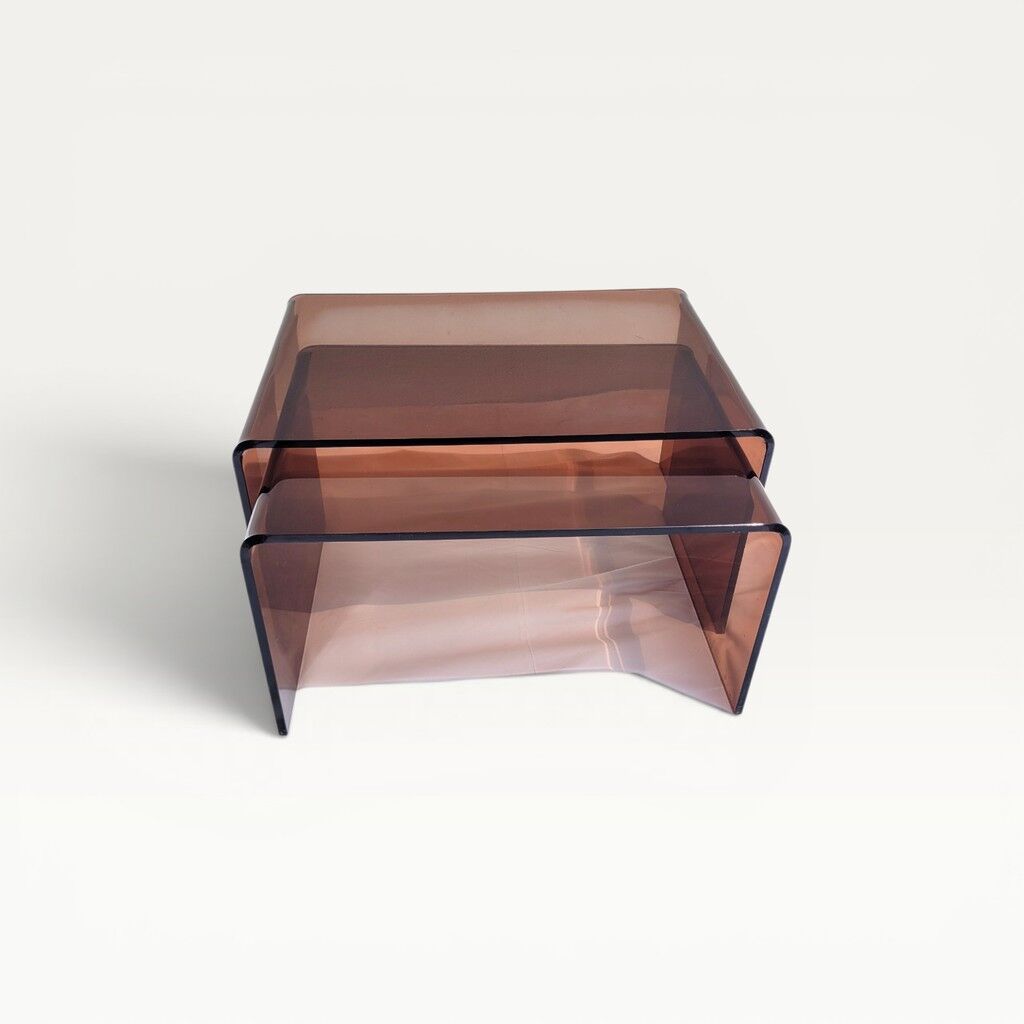 Pair of vintage smoked plexiglass nesting tables.