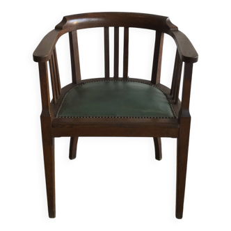 Office chair in oak and green faux leather.