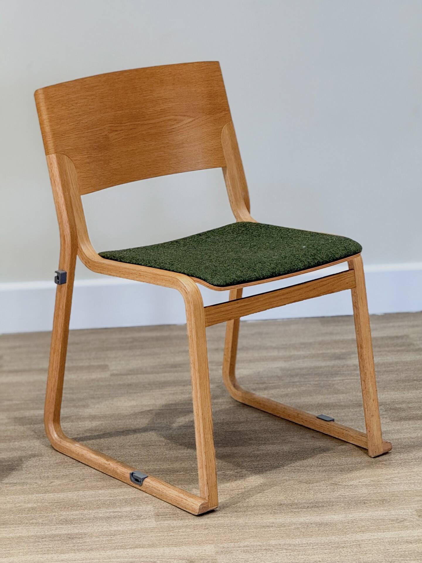 A set of four chairs in light oak (Theo chairs by Chorus)