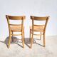 Pair of bistro chairs in light beech.