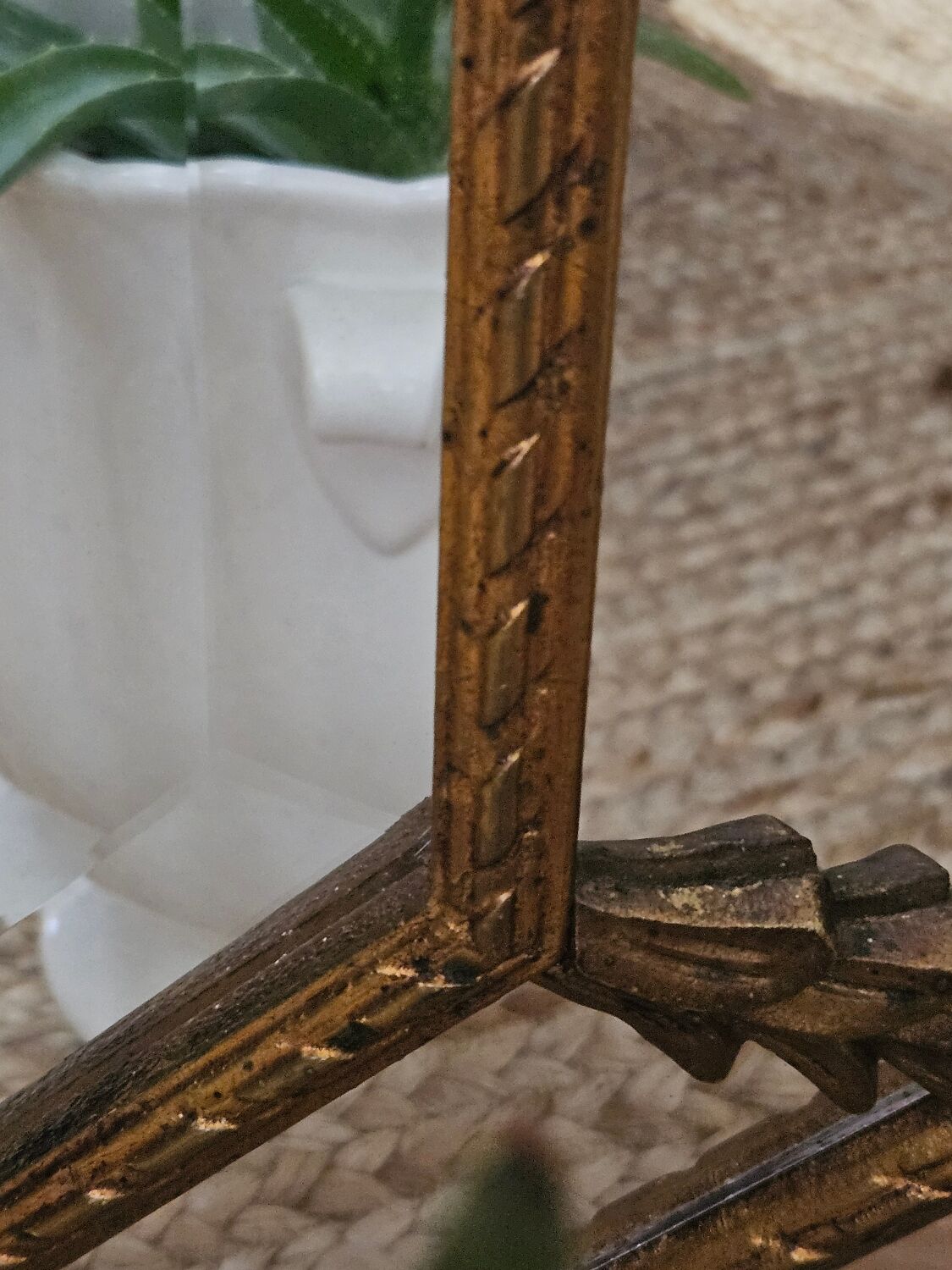 Bevelled mirror with neoclassical parcloses from the 20th century.
