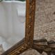 Bevelled mirror with neoclassical parcloses from the 20th century.