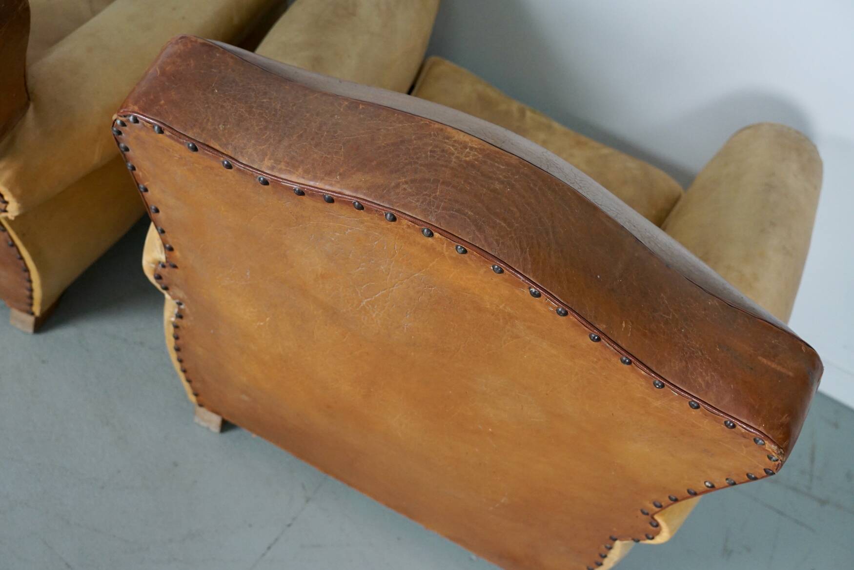 Pair of French Cognac Moustache Back Leather Club Chairs, 1940s