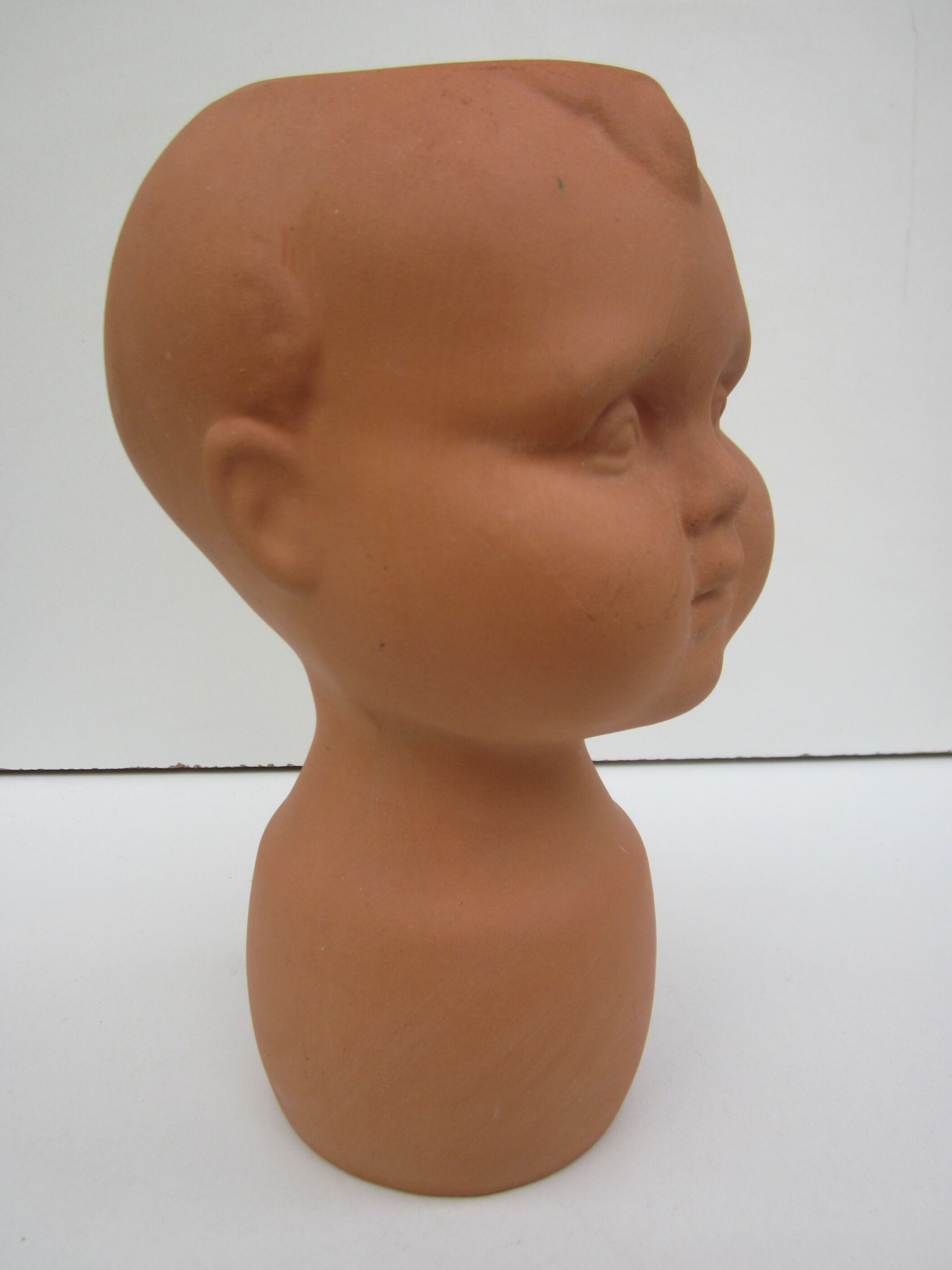 Terracotta vase: child's head