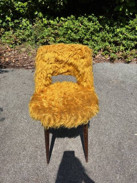 Old mustard furry armchair