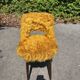 Old mustard furry armchair
