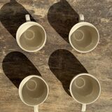 Set of 4 vintage speckled beige stoneware coffee cups.