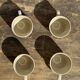 Set of 4 vintage speckled beige stoneware coffee cups.