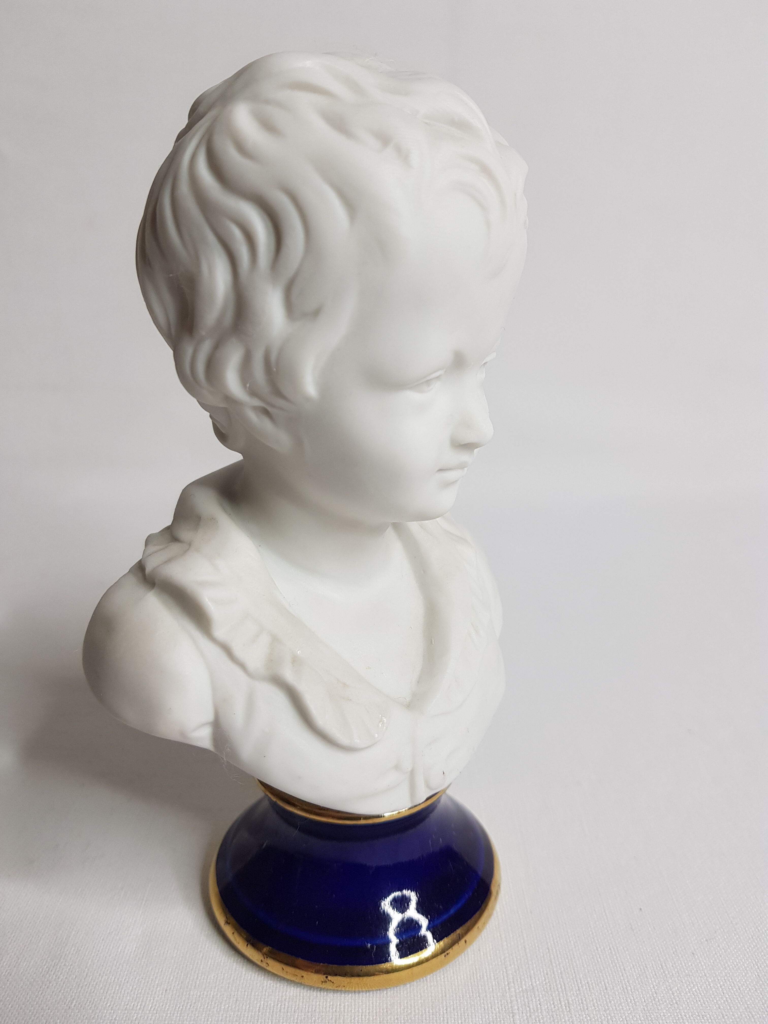 Porcelain biscuit bust, child, Alexandre Brongniart after Houdon