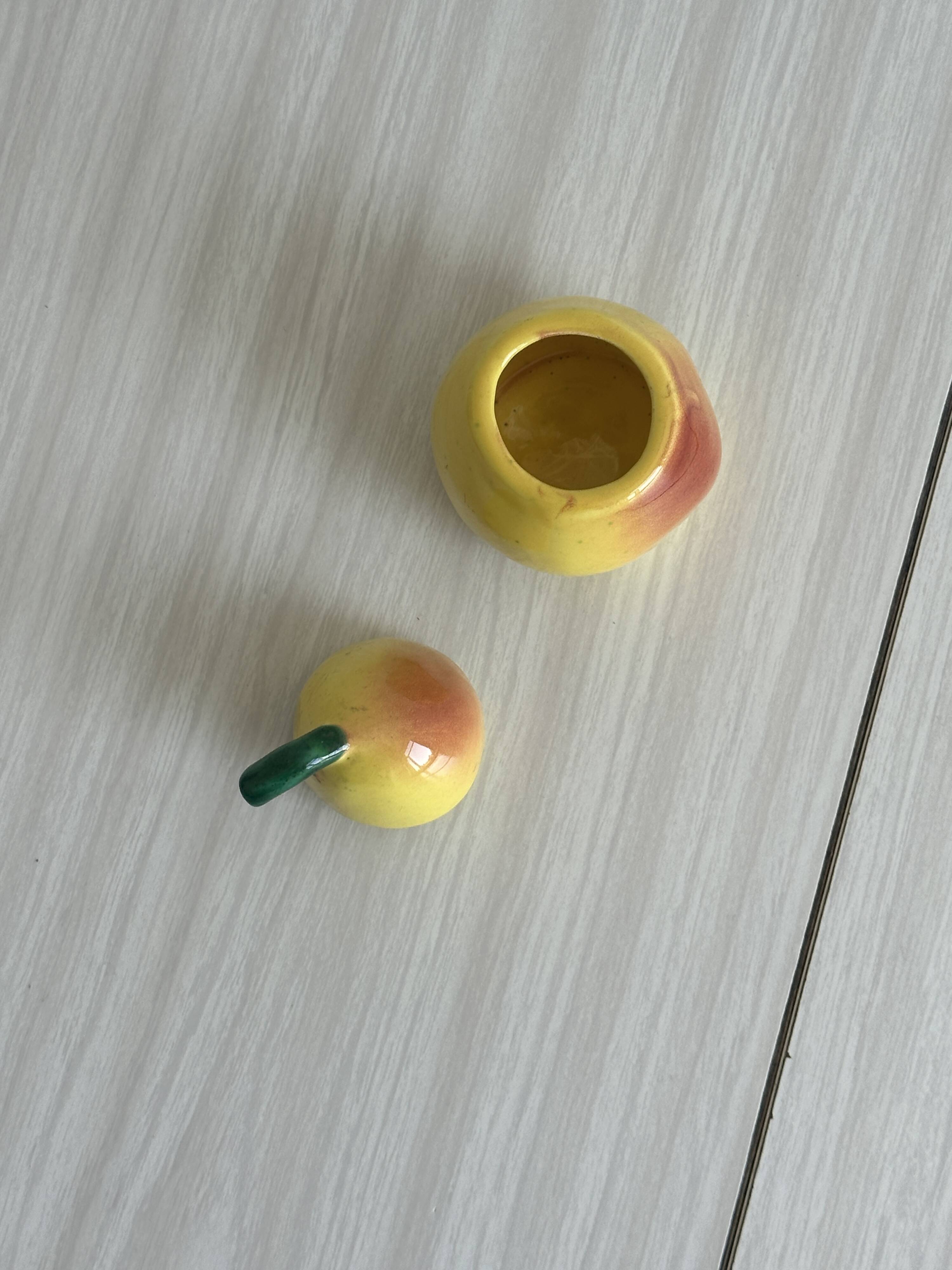 Yellow ceramic pear-shaped salt shaker