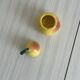 Yellow ceramic pear-shaped salt shaker