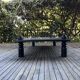 Table basse bois teinté noir brutaliste