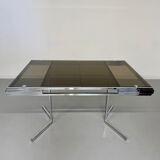Smoked glass dining table with chrome legs, 1970s design by Roche Bobois.