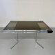 Smoked glass dining table with chrome legs, 1970s design by Roche Bobois.