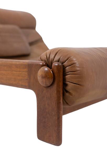 Lounge chair and ottoman, in blond elm and leather. 1970s