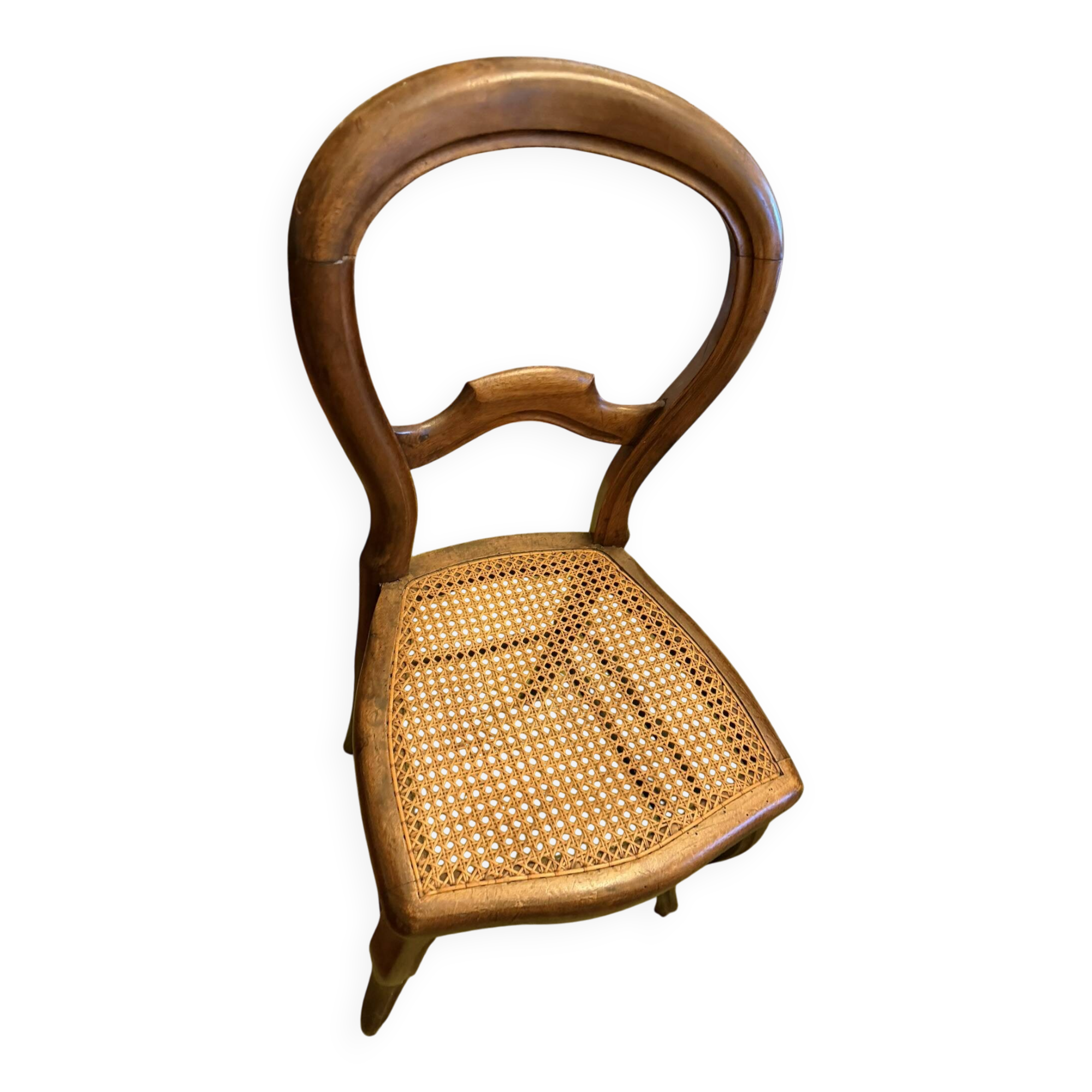 Light medallion chairs and carved fruit chairs.