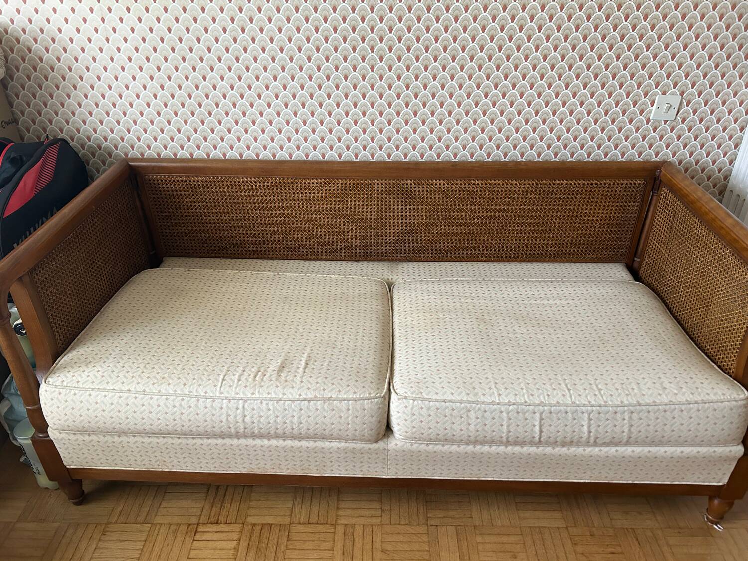 Vintage convertible wooden and cane sofa