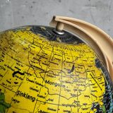 French mid-century school globe with black oceans on printed paper, cream plastic base