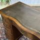 English desk from the 1950s in mahogany with a leather top.